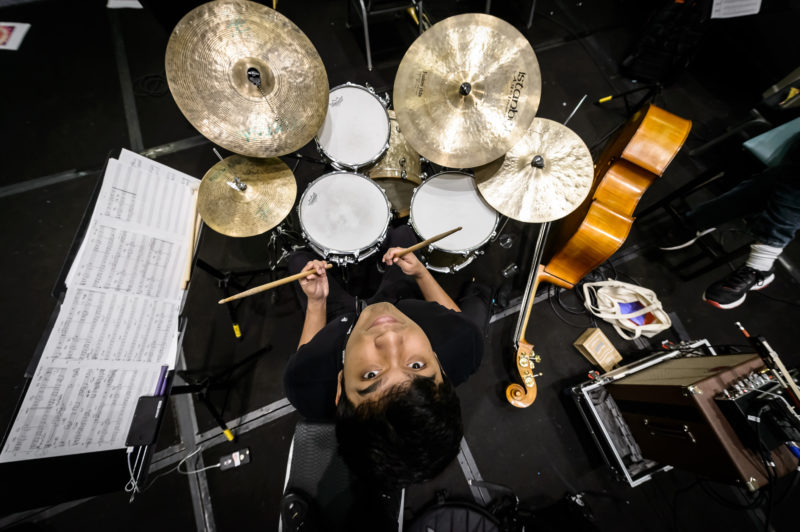 Overhead view of Varun Das seated at drum set