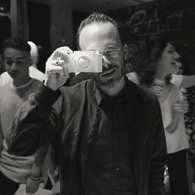 Daniel Arsham holding plaster camera in front of face