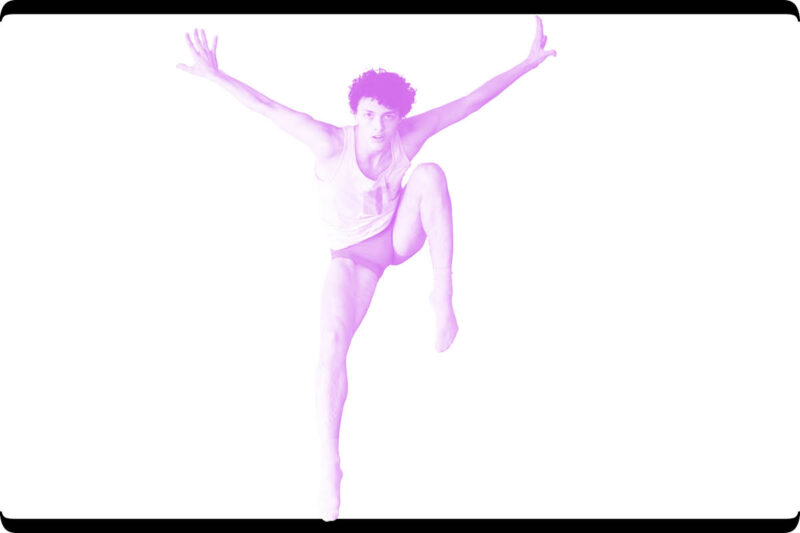 Dancer, young man leaping with hands outstretched