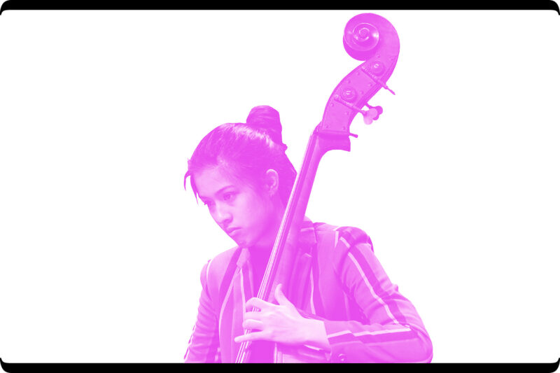 Young woman playing stand up bass