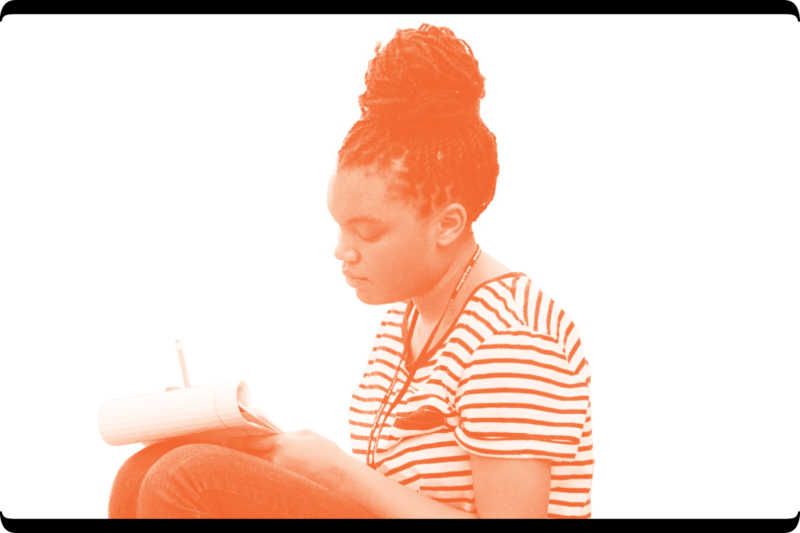 Young woman writing in a notebook