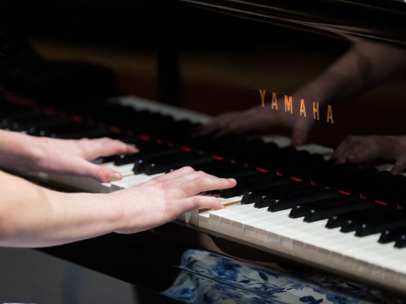 Photo of hands playing piano